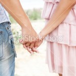 stock-photo-17661836-young-couple-holding-hands